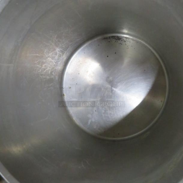 XXL stainless steel stock pot with lid, 21x20 inches. Light interior wear, suitable for large batch cooking.