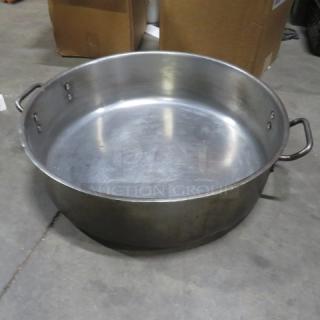 Aluminum braising pan, 20x6 inches, with dual handles, in used condition. No visible markings or tags.