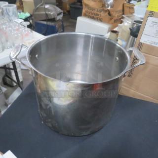 Cuisinart 12 quart stainless steel stock pot, 10.5x9 inches, with handles, in used condition.