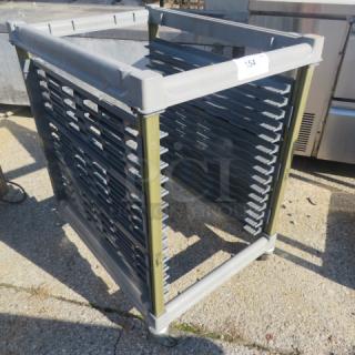Cambro ESXRMP33 speed rack on casters, 22x29x34 inches, durable frame, good condition, ideal for kitchen storage and transport.