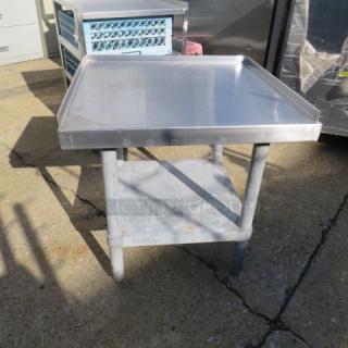 Stainless steel equipment table with under shelf, 24x24x25.5 inches, sturdy design, ideal for kitchen use.