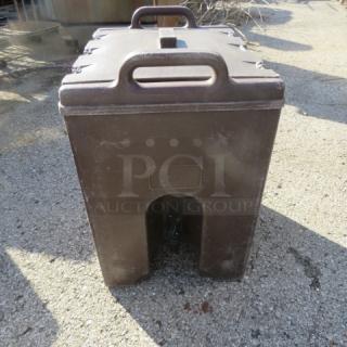 Cambro 1000LCD insulated beverage dispenser, brown, sturdy handles, used condition, outdoor use, markings on the front.
