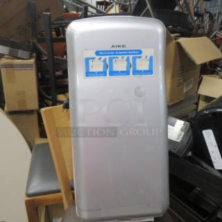AIKE AK2005H Electric Vertical Hand Dryer, silver, used, labeled with instructions. Model marked on unit.