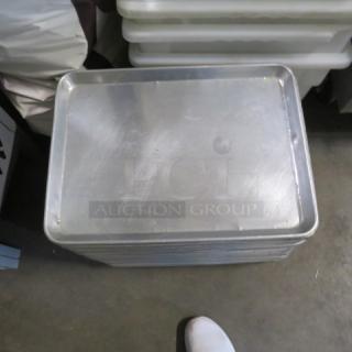 Full size aluminum sheet pan, model 5XBID, stacked with others. Lightly scratched, used condition.