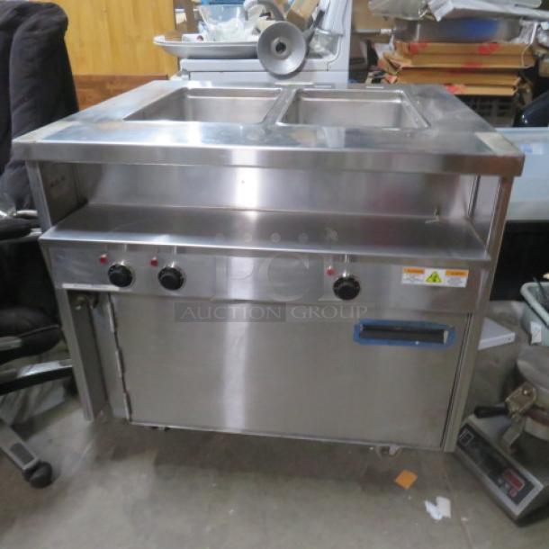 Randell 2 Well 1 Door Warmer on Casters, Model 31330, 208V, stainless steel, 36x33x34 inches, 3 control knobs, label indicates voltage.