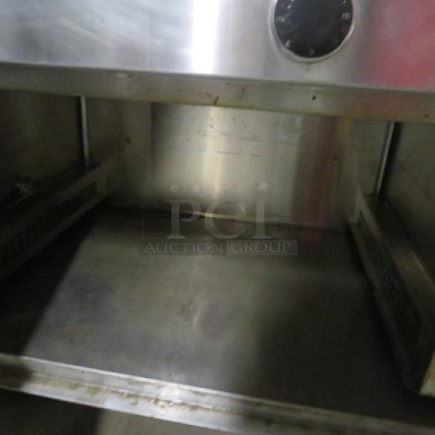 Randell 2-Well Warmer, Model 31330, stainless steel, on casters, 1 door, 36x33x34 inches, used, 208V, 1 phase.
