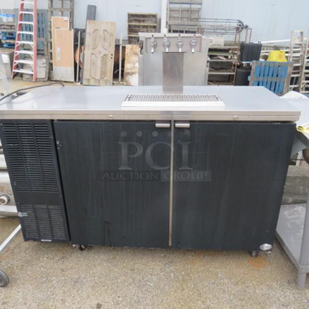 Perlick Kegorator Model DS60BLT, with 1 tower, 4 taps, on casters. Measures 60x25x38.5 inches, 115V. Working condition.
