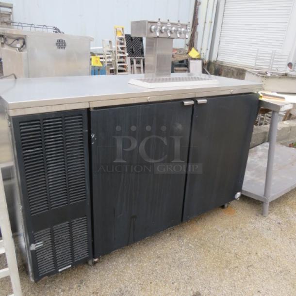 Perlick Kegorator model DS60BLT on casters, features 1 tower with 4 taps, 60x25x38.5 inches, 115V, condition shows wear.