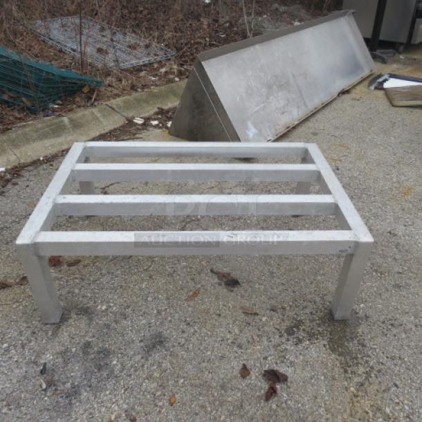 One Aluminum Dunnage Rack, 36x24x12 inches, used condition, for storage and organization. Sturdy metal frame design.