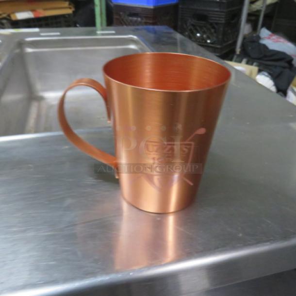 New copper mule mug with handle, engraved with "UZAY'S 19TH HOLE" logo. In excellent condition, model 5XBID.
