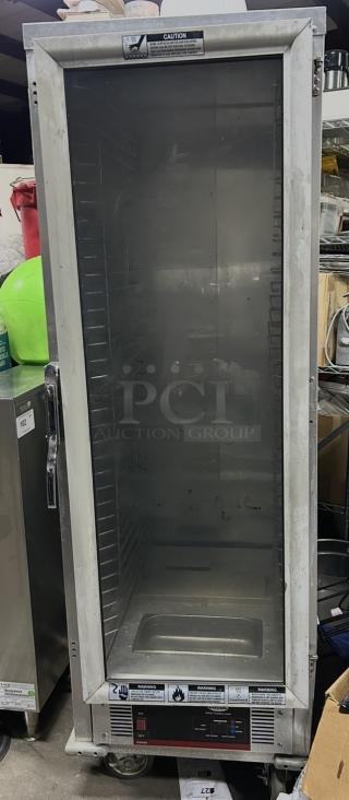 Cozoc Heat And Hold model HPC7008, 22x31x67 inches, on casters, 120 Volt, used condition, caution and warning labels visible.