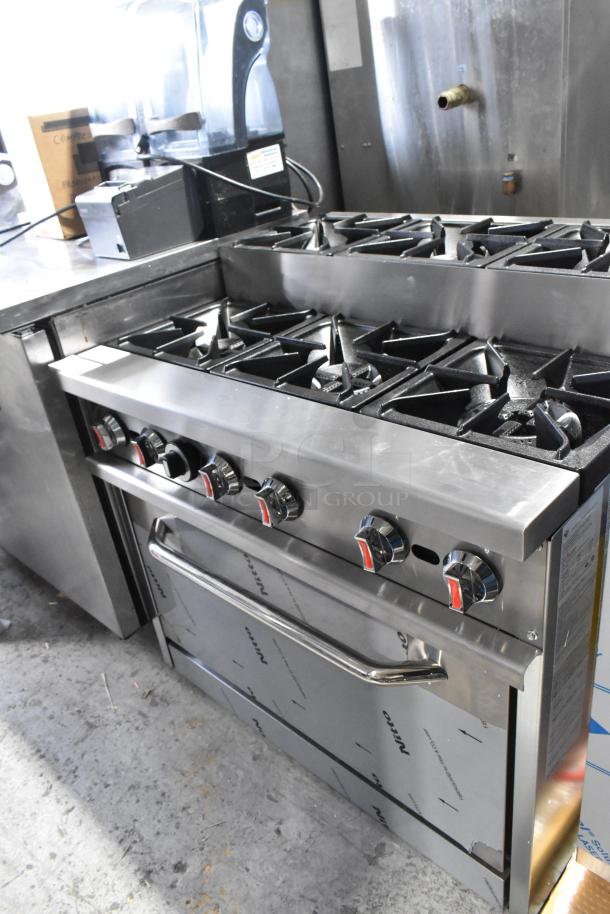 Brand new 2024 stainless steel commercial range, 6 burners, oven, and over shelf. Natural gas, 210,000 BTU. Model RC-ENR6B36TJ-NAT.