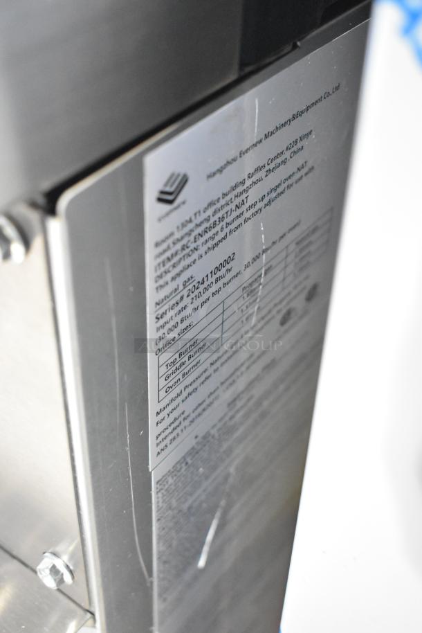 Stainless steel commercial range with 6 burners, oven, backsplash, overshelf; Model RC-ENR6B36TJ-NAT; 210,000 BTU.