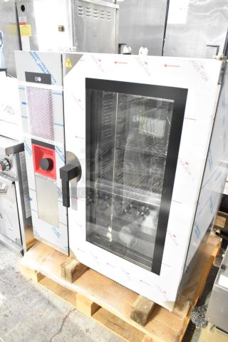 Bakers Pride stainless steel commercial combi convection oven, new with minor scratches, shown on a pallet.