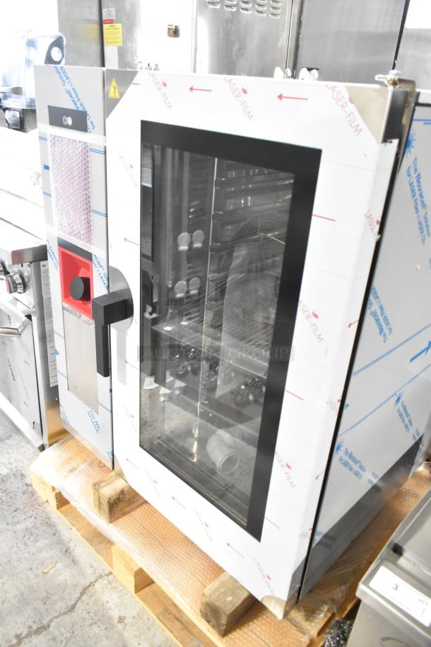 Brand new Bakers Pride stainless steel combi convection oven, scratch and dent, with protective film, commercial-grade.