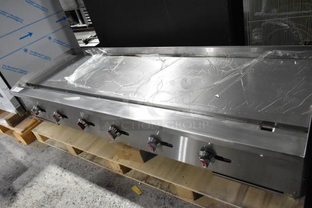 Brand new 2024 Hangzhou ENCTGM-72-L/N stainless steel griddle, 180,000 BTU, natural gas, minor dents, 5 control knobs.