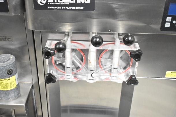 Stoelting F131-38I2 stainless steel soft serve ice cream machine with two flavors and twist feature, 208-240V, 1 phase.