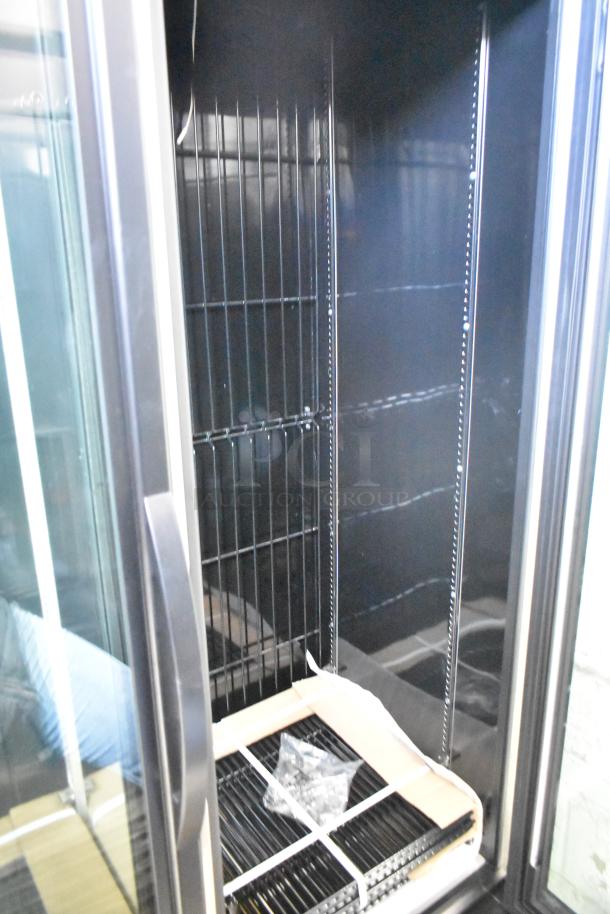 New 2025 True GDM-43F-SL-HC commercial cooler, 2-door, poly-coated racks, 115V, 1 phase, minor scratches visible.