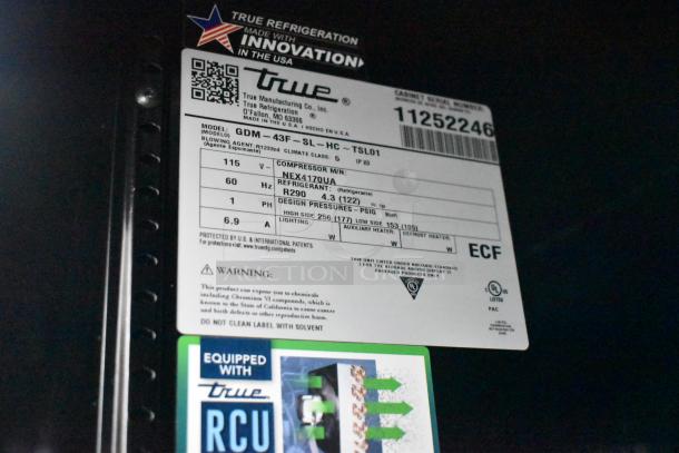 Label of True GDM-43F-SL-HC cooler, showing model specs and compliance markings, indicating new condition with slight imperfections.