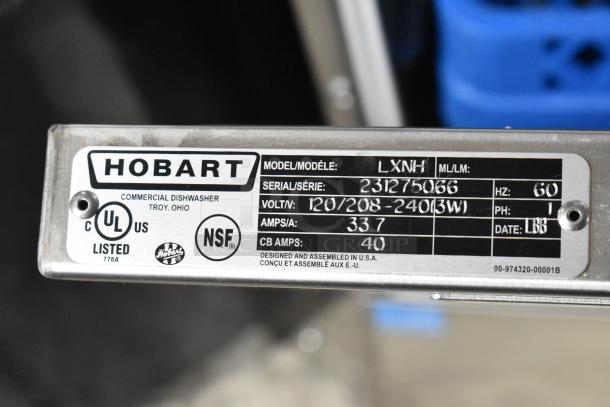 Hobart LXNH label showing model, serial number, voltage, and certification marks for a commercial dishwasher.