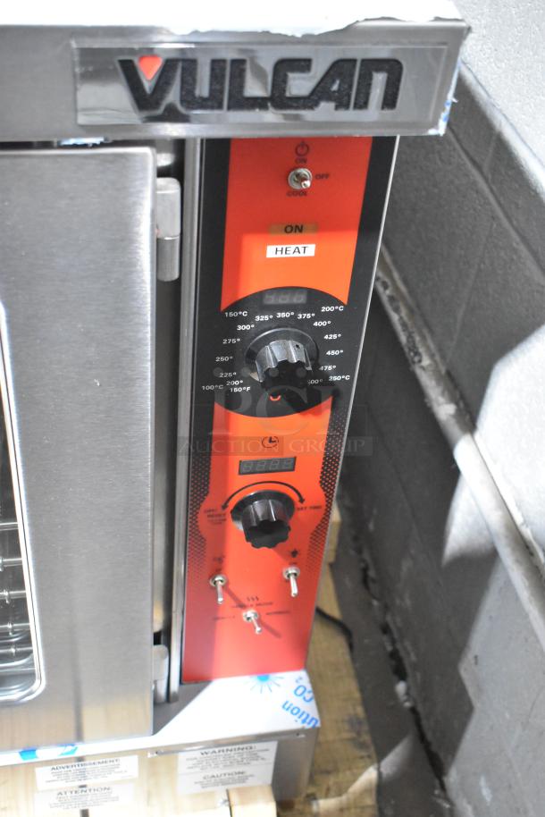 Brand new Vulcan VC5ED stainless steel convection oven with view-through doors, thermostatic controls, tags, and labels.