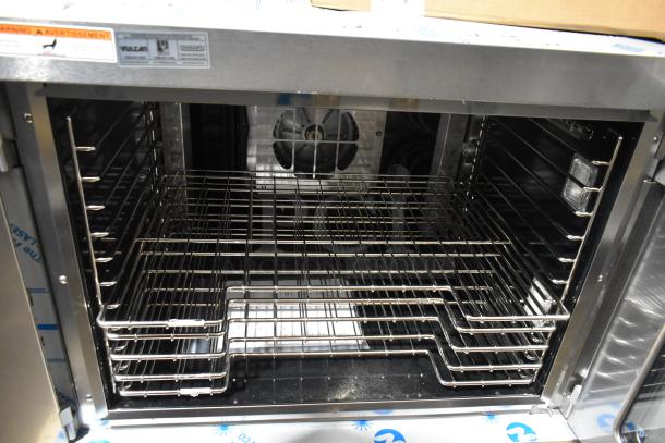 Brand new Vulcan VC5ED stainless steel electric convection oven, single deck, full size, thermostatic controls, metal racks, 208V.
