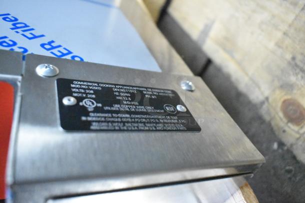 BRAND NEW Vulcan VC5ED Stainless Steel Commercial Electric Oven with view-through doors, metal racks, and thermostatic controls. Model info plate visible.