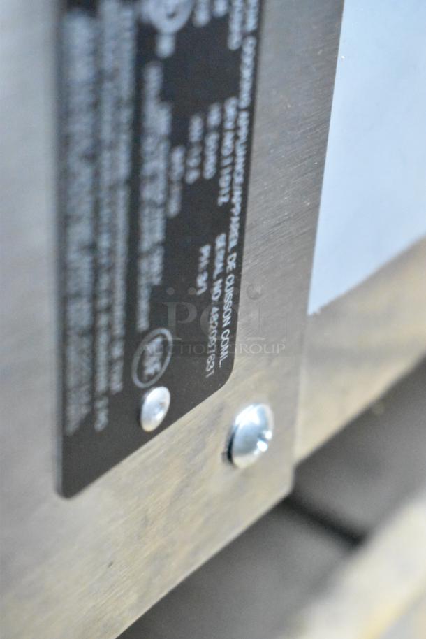 Metallic label on Vulcan VC5ED convection oven detailing model and specifications, including 208 volts, 3/1 phase.