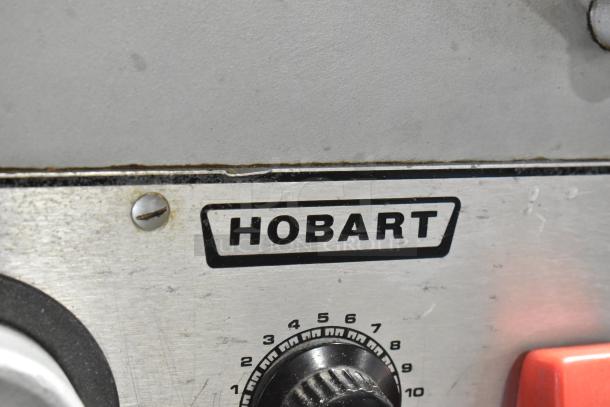 Hobart M 802 commercial 80qt dough mixer close-up showing brand logo and control dial, in used condition.