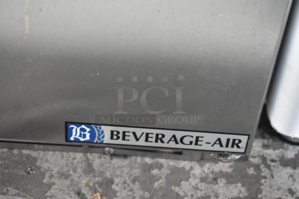 Stainless steel Beverage Air SPE72HC-30M 3-door refrigerated prep table, brand new, with minor scratches, 115V.