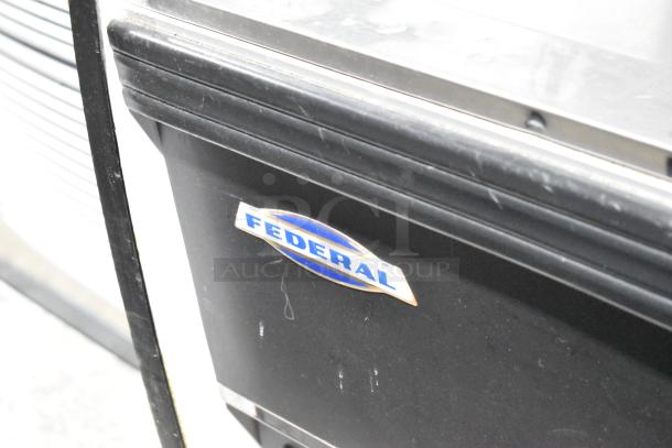 Federal Industries RSSM478SC commercial merchandiser with metal shelves, shown in good condition. Logo visible on front panel.