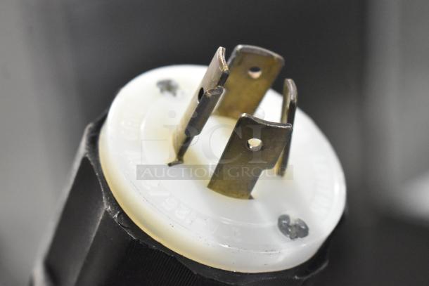 Close-up of a Federal Industries RSSM478SC plug, showing metal prongs and voltage markings. Suitable for 120/208-240 Volts, 1 Phase.