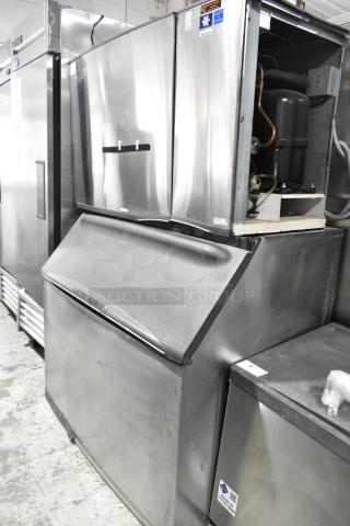 Manitowoc SD1802A stainless steel commercial ice head on bin. 208-230V, 1 phase, excellent condition, visible brand label.