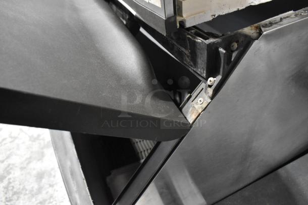 Manitowoc SD1802A stainless steel commercial ice head on ice bin, visible wear, 208-230 volts, 1 phase.