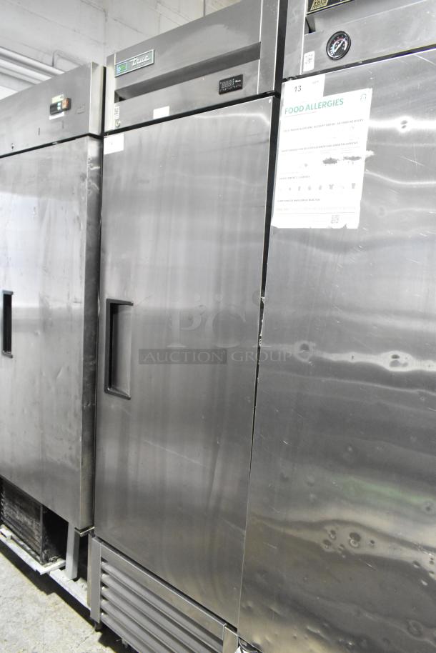2018 True T-23F-HC stainless steel single door reach-in freezer, commercial casters, poly-coated rack, 115V, 1 phase.