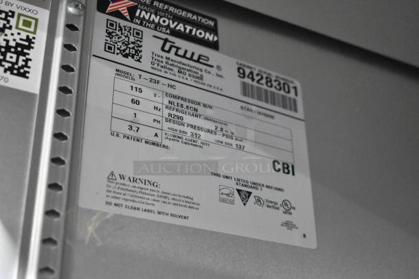 2018 True T-23F-HC stainless steel reach-in freezer label showing model, voltage, and refrigerant details.