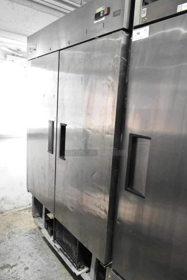 Avantco 178A49FHC stainless steel 2-door commercial freezer on casters, includes poly-coated rack, 115V, 1 phase. Signs of use visible.