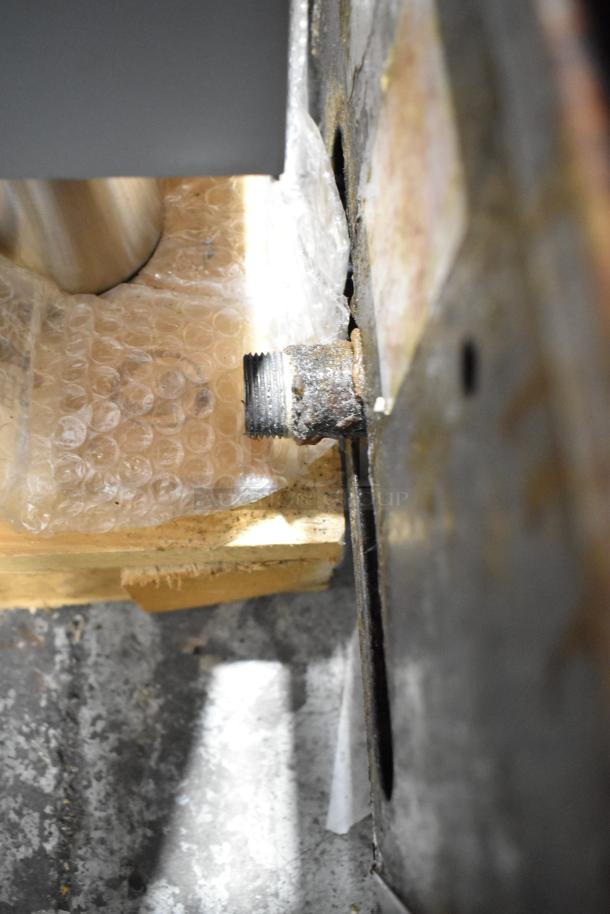 Rusted connection point on Garland stainless steel commercial countertop gas flat top griddle. Appears used, needs maintenance.