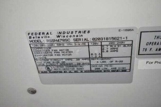 Label on Federal Industries RSSM478SC merchandiser indicating model, serial number 02031815621-1, voltage, and specs.
