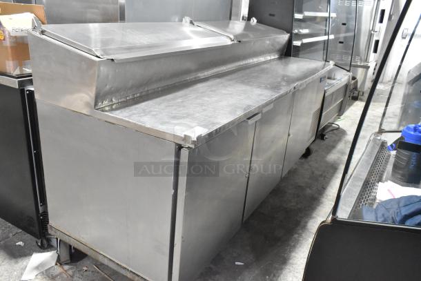 McCall PTA-3 stainless steel pizza prep table with commercial casters. Features include dual compartments, 115 volts, 1 phase.