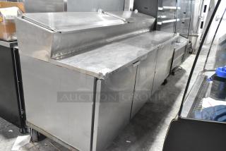 McCall PTA-3 stainless steel pizza prep table with commercial casters. Features include dual compartments, 115 volts, 1 phase.