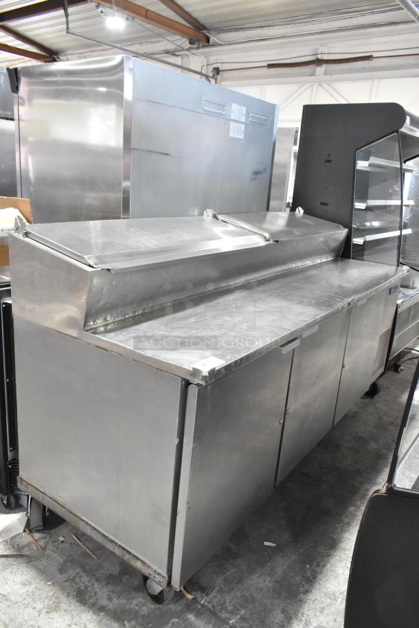 McCall PTA-3 stainless steel pizza prep table, commercial casters, 115V, 1 phase. Durable condition, ideal for restaurant use.