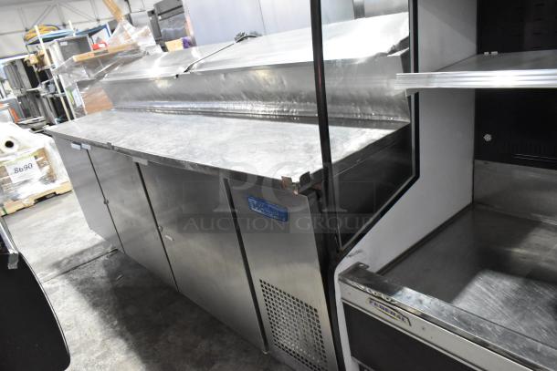 McCall PTA-3 stainless steel commercial pizza prep table on casters, 115V, 1 phase, with visible brand label and storage compartments.