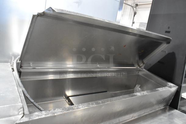 McCall PTA-3 stainless steel pizza prep table with open lid, on commercial casters. 115 volts, 1 phase. Good condition.