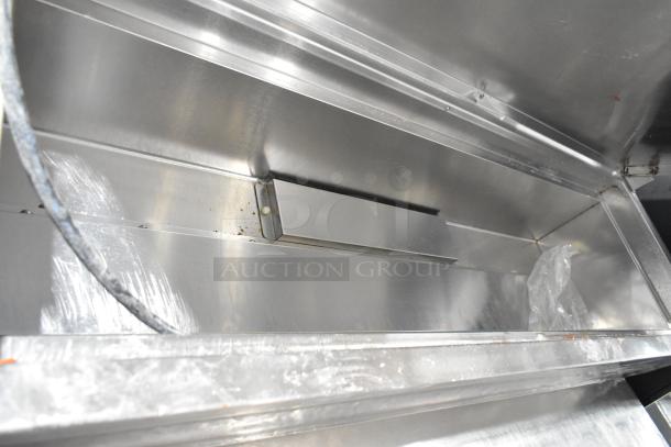 McCall PTA-3 Stainless Steel Commercial Pizza Prep Table interior, showing clean surfaces, on commercial casters, 115V, 1 Phase.