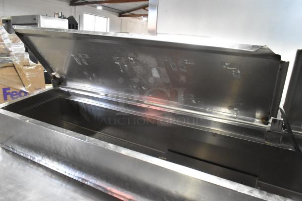 McCall PTA-3 stainless steel commercial pizza prep table with open lid, on commercial casters. 115 Volts, 1 Phase.