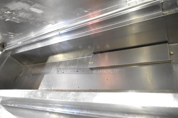 McCall PTA-3 stainless steel commercial pizza prep table with visible wear, featuring commercial casters. 115 volts, 1 phase.