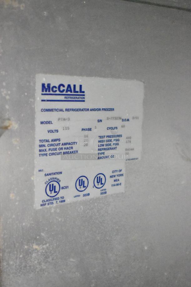 McCall PTA-3 stainless steel pizza prep table, commercial casters, 115 volts, 1 phase, model label visible.