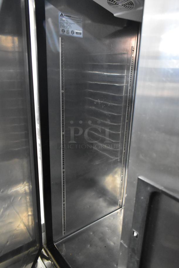 Everest EBR2 stainless steel 2-door reach-in cooler; 115 volts, 1-phase, commercial grade, interior view, good condition.