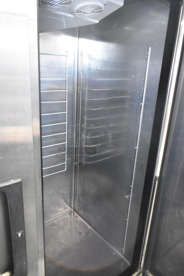 Everest EBR2 Stainless Steel Commercial 2 Door Reach In Cooler, 115 Volts, 1 Phase, clean interior, shelving slots visible.